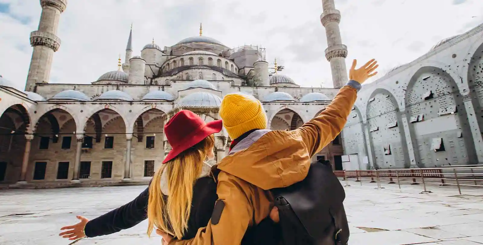 A couple in a historic mosque in Turkey: Turkish cities suit people with all kinds of lifestyle