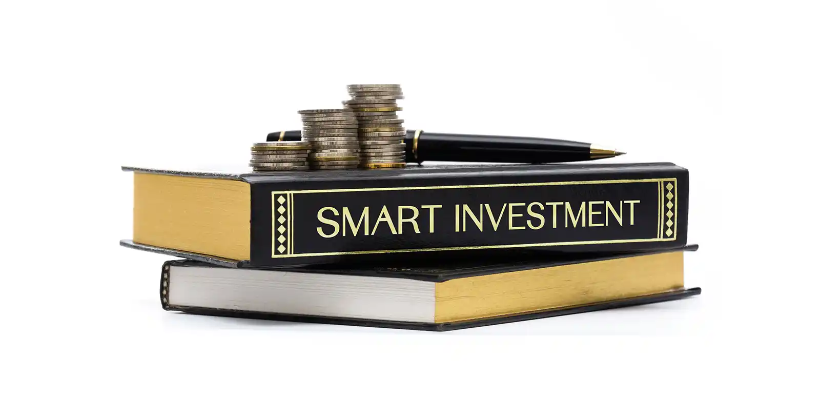 a pen, some coins, and a book named smart investment representing that villas are smart investment options