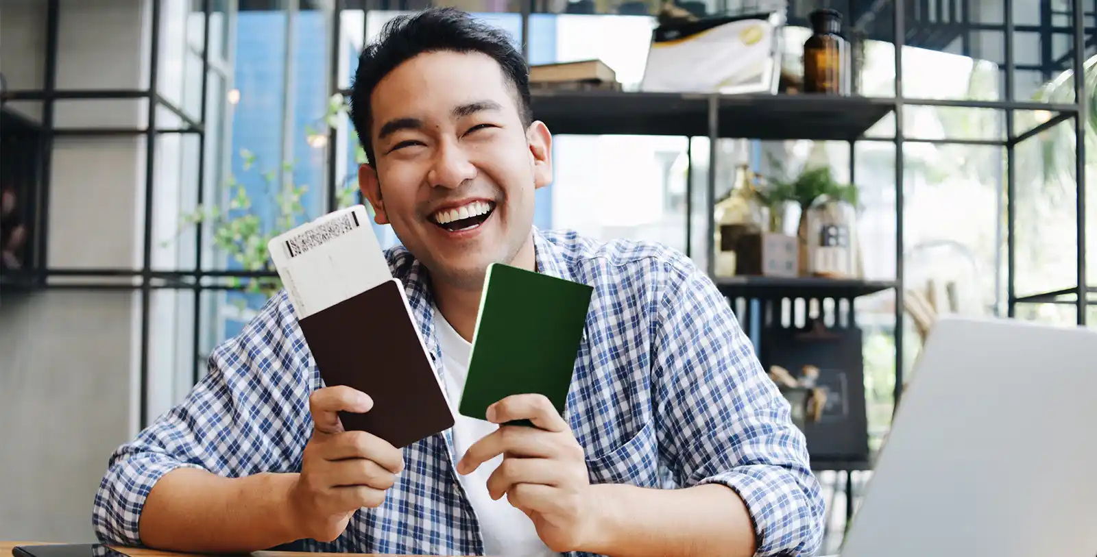 A happy man with two passports: dual citizenship gives you enourmous freedom