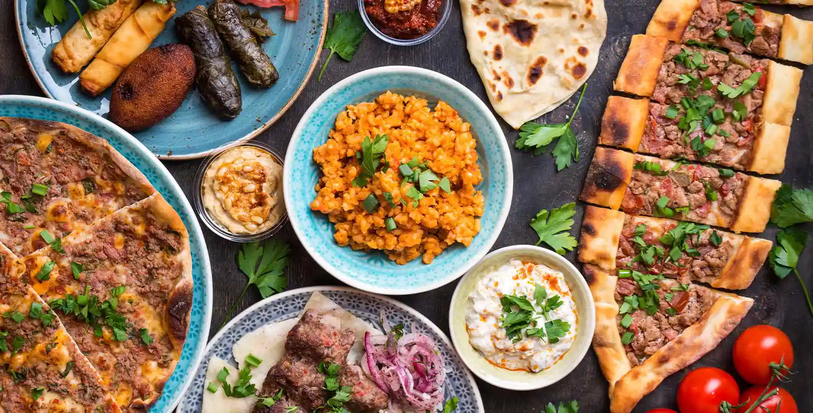 Turkish food or food offered in Istanbul covers all the tastes from vegans to meat lovers.  A colorful table of Turkish food.
